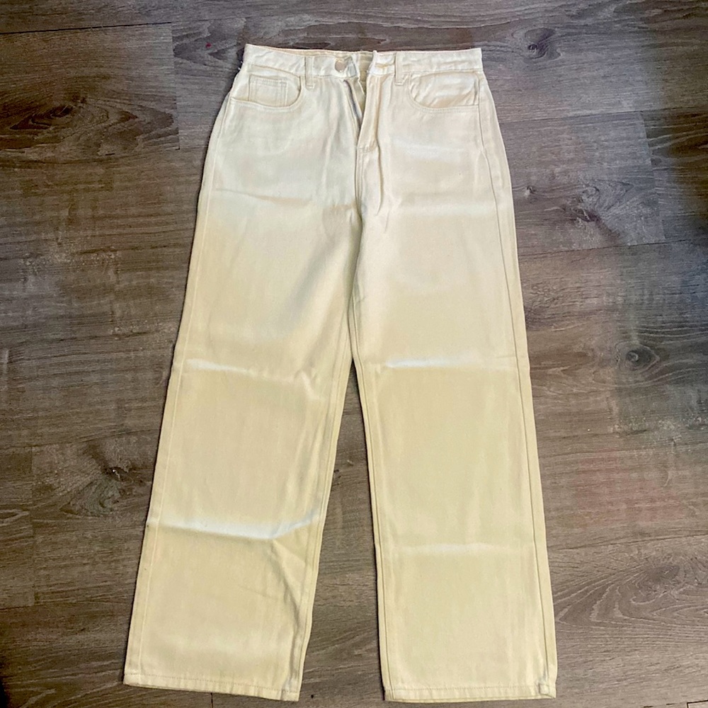 Never use cream pants Width 29 in length 39 in